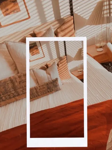 Bed at an angle with a duplicated image with a white border in the middle